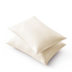 two white pillows sitting on top of each other