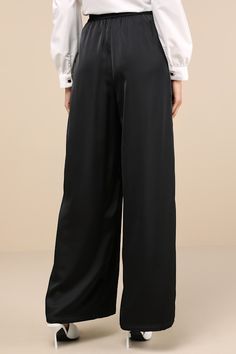 The Lulus Stunning Chicness Black Satin High-Rise Wide-Leg Pants will easily elevate any of your favorite fall 'fits! Sleek woven satin shapes these must-have pants that feature a high, banded waist (with elastic at the back for fit) and trendy, wide pant legs with pleated details, side seam pockets, and full-length hems. Hidden side zipper/clasp. Add a sweater and some boots and you'll instantly have a perfect ensemble! Fit: This garment fits true to size. Length: Floor length. Size medium Inse Sleek Silk Wide Leg Pants, High-waisted Satin Pants For Work, Elegant Wide Leg Satin Pants For Formal Occasions, Elegant Satin Wide Leg Pants For Formal Occasions, Formal High-waisted Satin Pants, Formal Satin Straight Pants, Elegant Silk Satin Bottoms, Sleek Silk Pants For Workwear, High-waisted Satin Pants For Formal Occasions