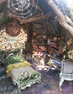 a room filled with lots of furniture covered in plants and decorations on top of it