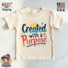 a child's t - shirt with the words created with a purpose on it