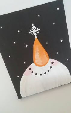 a black and white painting with an orange cone on it's head in the snow