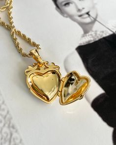 This Love Token Locket Necklace is the perfect piece for anyone looking to add a touch of elegance and romance to their wardrobe. Crafted from high-quality gold plating, it serves as a beautiful symbol of love and affection. Wear it close to your heart as a reminder of the special bond you share with your loved one. Gold Plated Silver functioning heart locket measuring 25mm x 20mm x 6.7mm. Gold plated Brass Rope chain 2.5mm thick and 16-18 inches in length. Gold Heart Pendant Locket Necklace, Gold Heart Pendant Locket Necklace For Wedding, Gold-tone Fine Jewelry Necklace For Wedding, Gold Heart Locket Necklaces, Classic Double Heart Gold Jewelry, Elegant Gold Plated Locket Necklace For Anniversary, Gold Plated Locket Necklace, Classic Gold Heart Jewelry, Elegant Medallion Heart Necklace As A Gift