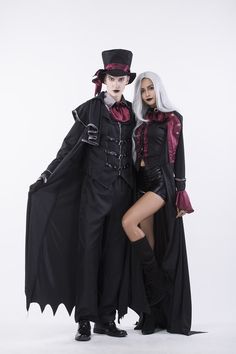 two people dressed in costumes posing for a photo