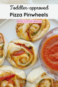 small pizza pinwheels on a plate with sauce