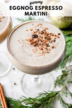 two glasses filled with eggnog espresso martini on top of a table