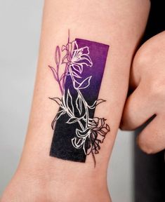 a woman's arm with a flower tattoo on the left side of her body