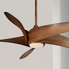 a ceiling fan that is hanging from the ceiling