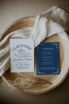 a blue and white wedding suite on a wooden plate