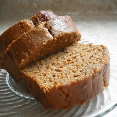 two slices of banana bread on a glass plate