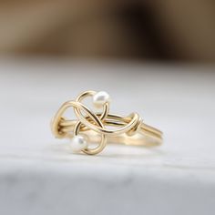 A unique ring with a classy touch just for you! Handmade with love, set with two fresh water pearls ☆ WHY THIS PIECE OF J E W E L R Y IS AWESOME! ☆ * Hand finished and made from high quality raw materials * Long lasting beauty & Timeless design * Available in Gold, Rose Gold or Sterling Silver ♡ WRAPPING ♡ * All 23 Summers jewels arrive in a cute pouch or gift box so they are gift ready. DELIVERY ✉ * Most items are ready made but some are made to order, Times for each items are shown on * We Elegant Wire Wrapped Promise Ring, Minimalist Hand Wrapped Wedding Rings, Wire Wrapped Wedding Rings, Elegant Wire Wrapped Wedding Rings, Anniversary Toe Ring With Wire Wrapped Detail, Elegant Hand Wrapped Rings For Anniversary, Elegant Adjustable Hand-wrapped Rings, Elegant Wire Wrapped Rings For Gifts, Elegant Wire Wrapped Ring