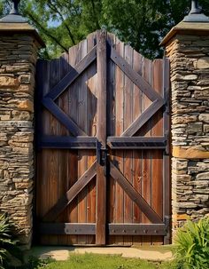 an open wooden gate in front of a stone wall