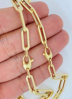 "Genuine 14K Yellow Gold Paperclip Necklace and Bracelet.  This trending paperclip necklace is an amazing gift for anyone. BEST PRICES AND SUPERIOR ITALIAN QUALITY! Metal: 14K Yellow Gold Bracelet Length: 6.5inch 7inch - 7.5 inch 8inch, 8.5inch Necklace Length: 15inch (Choker), 16inch, 18inch, 20inch  Necklace Width: 3 mm- 6 mm THe Thickness of the 6mm like are 2mm. This is a chunky look. VERY  COMPETITIVELY PRICED! Clasp: Lobster Country of Origin: Italy  Necklace and Bracelet must be purchased Luxury Timeless Paperclip Jewelry, Luxury Yellow Gold Charm Necklace With Clavicle Chain, Cheap Yellow Gold Link Necklaces, Luxury Yellow Gold Bar Necklace In Fine Jewelry Style, Luxury Yellow Gold Bar Necklace Fine Jewelry, Luxury Fine Jewelry Bar Necklace For Women, Luxury Rectangular Link Necklace For Women, Cheap Yellow Gold Clavicle Chain Charm Necklace, Luxury Chic Paperclip Chain Necklace