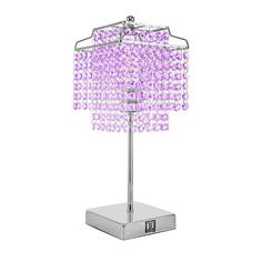 a table lamp with purple beads on it