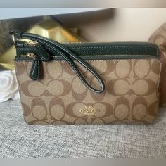 Signature Coated Canvas And Refined Pebble Leather, Fabric Lining. Wrist Strap Attached. Eight Credit Card Slots. Double Zip Closure. Fits All Hone Sizes Up To An Iphone X And Samsung S7 Edge. 8.0”(L) 4.75(H) 1.0”(W) Everyday Use Coach Crossbody Clutch, Coach Clutch With Removable Pouch For Daily Use, Coach Clutch With Zipper For Daily Use, Everyday Coach Clutch, Coach Rectangular Travel Clutch, Coach Wallets With Zipper Closure For Everyday Use, Coach Wallets With Zipper Closure, Coach Rectangular Clutch For Daily Use, Coach Zipper Pouch Coin Purse For Travel