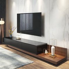 a living room with a large television on the wall