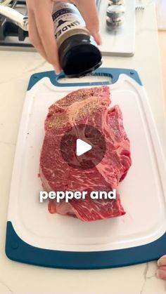 someone is using pepper and seasoning to cut up a piece of meat