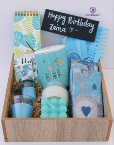 a wooden box filled with personal items and a sign that says happy birthday lunaa