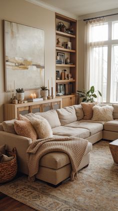 15 Cozy Living Room Decor Ideas That Will Make You Want to Snuggle Up! Cozy Throw Pillows Couch, Living Room Light Furniture, Fur Pillows Living Room, Living Room Oatmeal Couch, Living Room Inspo Cream Couch, Cozy Timeless Home, Tan Sectional Living Room Color Schemes, Living Room Sofa In The Middle, Boho Clean Living Room