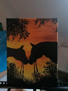 two horses kissing each other in front of a painting on a canvas with trees and birds