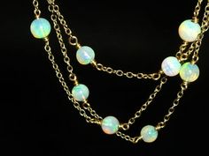 Opal, Sunstone & Pearl Chain (Recommended) - Biographie Handmade Ethiopian Opal Elegant Jewelry, Elegant Ethiopian Opal Pendant Necklace, Elegant Ethiopian Opal Jewelry With Natural Stones, Gold Opal Round Beads Necklace, Gold Opal Necklace With Round Beads, Luxury Opal Necklace With 17 Jewels, Elegant Single Strand Ethiopian Opal Jewelry, Elegant Oval Wire Wrapped Necklace, Elegant Ethiopian Opal Gemstone Jewelry