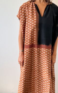 A longer caftan in gorgeous terracotta Ikat with black trim.  This is a mid weight hand woven cotton fabric with opaque coverage. A perfect piece to be worn on its own as a dress or as a fabulous coverup for the beach. Custom fabric design by Two Ikat weave Hand spun cotton Length 49"  Width 33" Kantha Jacket, Boho Beachy, Mid Dresses, Woven Cotton, Black Trim, Sewing Inspiration, Simple Dresses, Cotton Weaving, Boho Style