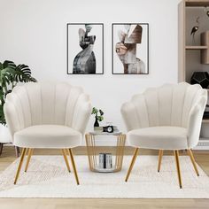 two white chairs sitting next to each other in a living room