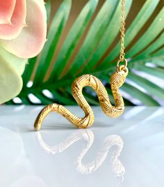 Gold Snake Necklace Alluring textured Turkish snake pendant necklace on a 14k gold chain Pendant: 2" Long Necklace: 12" Long in total Your necklace will arrive gift-wrapped! View more pendant necklaces!--> http://etsy.me/2lVN92R Shop Lauren Alleyne Jewelry on Etsy!--> http://etsy.me/2eFm9mK Gold Snake Necklace, Snake Pendant Necklace, Snake Jewelry, Gold Snake Charms, Serpent Charm Unique Gold Chain Necklace As Gift, Unique Gold Chain Necklace For Gift, Unique Gold-tone Jewelry As Gift, Unique Gold-tone Jewelry For Gift, Nickel-free Gold Snake Jewelry, Brass Snake-shaped Necklace For Gifts, Nickel-free Snake-shaped Jewelry Gift, Snake Chain Necklace For Gift, Unique Gold Necklace As Gift For Her