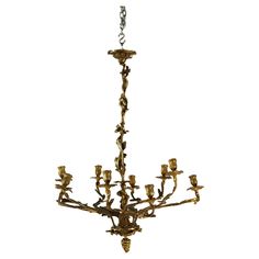 an antique chandelier with many candles on it