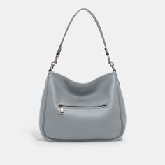 Deliberately slouchy with a sophisticated ease our Cary is a study in intentional laidback style. Crafted of buttery soft pebble leather with a silky sheen this surprisingly spacious bag has plenty of pockets to keep you organized. (Because even your most easygoing self should feel put-together.) | Coach Cary Shoulder Bag - Women's Purses - Silver/grey Blue Pebbled Leather Satchel For Travel In Fall, Fall Travel Satchel In Pebbled Leather, Double Handle Pebbled Leather Shoulder Bag For On-the-go, Fall Satchel With Detachable Strap And Pebbled Leather, Fall Pebbled Leather Satchel With Detachable Strap, Leather Shoulder Bag With Silver-tone Hardware For On-the-go, Classic Everyday Satchel With Silver-tone Hardware, Fall Pebbled Leather Satchel Bag, Everyday Satchel With Handle Drop In Pebbled Leather