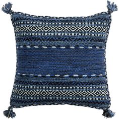 a blue and white pillow with tassels