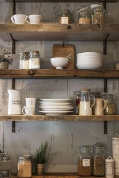 the shelves are filled with dishes and cups