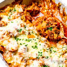 a casserole dish filled with meat and cheese