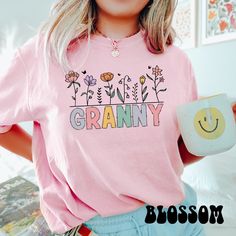 Give your grandma the gift of comfort and style with this floral-themed Comfort Colors Mom Grandma Shirt, perfect for Mother's Day or as a thoughtful gift for a great-grandma. With its charming design, this shirt is also a great way to reveal the arrival of a new family member. Save by bundling! We offer these great discounts on bulk orders: - 30% on 10+ items (use code BUNDLE10) - 35% on 20+ items (use code BUNDLE20) ➭ How to Order 1. Choose your shirt size & color options. 2. Select the quanti Granny Shirts, Great Grandma Gifts, Grandma Shirt, Grandma Shirts, Gift For Grandma, Grandma Gift, Baby Reveal, Mom And Grandma, Grandma Gifts