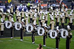 a marching band is performing on the field