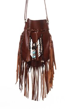 Medium American native style handmade leather bag. Handcrafted bone bead and natural coconut bead embellishment choker attached as decoration Fully lined inside with one pocket. The adjustable leather shoulder strap fits either across the body or slung over your shoulder. Material: leather, cow bones,coconut bead, turquoise crystal bead 8.2 in wide, 11.4 in long. total long include feather fringes 18.9 in aprox 21 cm wide,29 cm long. total long include leather fringes 48 cm aprox Best finishing Brown Artisan Shoulder Bag For Festivals, Bohemian Leather Hobo Bag With Tassels, Brown Hobo Bag For Festival, Artisan Leather Shoulder Bag For Festival, Bohemian Leather Bucket Bag Handmade, Handmade Leather Bohemian Bucket Bag, Handmade Leather Shoulder Bag For Beach, Bohemian Hobo Bag With Fringe For Travel, Bohemian Handmade Leather Bucket Bag