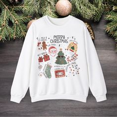 Get into the holiday spirit with this family Christmas sweatshirt. Perfect for matching family Christmas gatherings, this cozy sweatshirt is made with a medium-heavy fabric blend of 50% cotton and 50% polyester, providing warmth during the colder months. The classic fit and crew neckline offer a comfortable wearing experience with added durability from the double-needle stitching. Say goodbye to itchiness with the tear-away label. Ideal for families looking to coordinate their holiday attire wit Family Matching Festive Crew Neck T-shirt, Holiday Attire, Christmas Gathering, Holiday Sweatshirt, Sweatshirt Christmas, Cozy Sweatshirts, Christmas Sweatshirts, Christmas Sweater, Family Christmas