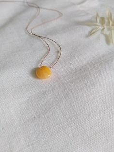 Minimalist Gemstone Necklace Natural silk, adjustable up to 25" Yellow tone heart shaped natural gemstones knotted on silk, dainty style. Can send photos upon request of choice of stone. Option to add pearls. Beautiful bohemian style necklace, perfect as a gift. Dainty Adjustable Yellow Jewelry, Handmade Yellow Baltic Amber Necklaces, Handmade Baltic Amber Necklace In Yellow, Handmade Yellow Baltic Amber Necklace, Adjustable Yellow Lariat Jewelry, Adjustable Yellow Lariat Necklace, Adjustable Amber Citrine Necklace, Adjustable Yellow Necklace For Everyday, Everyday Adjustable Yellow Necklaces