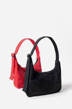 Slightly slouchy, slightly structured, Baggu's Mini Nylon Shoulder Bag is perfect for that everyday style you LOVE! Complete with an interior pocket so everything has a place. 21.5" adjustable quilted strap Measures 6" × 9" × 2.75" Interior zip pocket. Recycled heavyweight nylon, recycled ripstop nylon lining Machine washable Black Nylon Bags, Everyday Black Nylon Shoulder Bag, Black Foldable Nylon Bag, Black Reusable Nylon Bag, Baggu Mini Nylon Shoulder Bag, Mink Pink, Scarf Hat, Sweater Sale