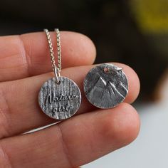 "A delicate necklace that features inspirational \"Nature girl\" inscription on one side and has a carved mountain landscape on the other side. Wear it as you want! I sculpted it from silver metal clay and then fired it to become fine silver. The mountain landscape thus can be a little different for each necklace. The pendant is about 12mm (1/2\") in diameter. You can buy it with or without dainty sterling silver chain. If you are buying it as a gift I would suggest 16\" (40cm) or 18\" (45cm) ch Nature-inspired Silver Hand Stamped Jewelry, Nature-inspired Stamped Jewelry For Everyday, Nature-inspired Silver Etched Necklaces, Silver Etched Nature-inspired Necklaces, Personalized Nature-inspired Sterling Silver Necklaces, Personalized Sterling Silver Nature-inspired Necklaces, Silver Engraved Nature-inspired Necklace, Nature-inspired Engraved Sterling Silver Necklace, Mountain Texture