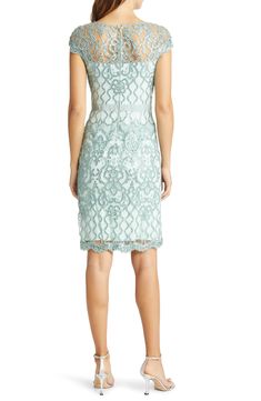 An elegant sheath exquisitely fashioned from ornate lace asparkle in tonal sequins is perfect for weddings, cocktail parties and date nights. 40" length (size 8) Hidden back-zip closure Bateau neck Cap sleeves Partially lined 60% polyester, 40% nylon with 60% cotton, 40% nylon contrast Dry clean Imported Special Occasion Elegant Lace Sequin Cocktail Dress, Glamorous Lace Dress With Fitted Bodice, Glamorous Lace Evening Dress For Spring, Glamorous Lace Dress For Gala In Spring, Glamorous Fitted Lace Dress, Glamorous Holiday Lace Dress, Glamorous Spring Gala Lace Dress, Formal Fitted Evening Dress With Lace Work, Holiday Evening Lace Dresses