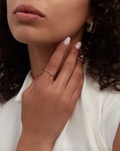 a close up of a person wearing a ring