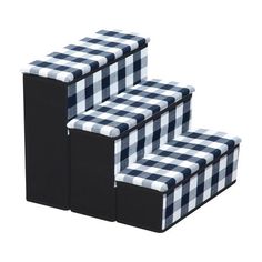 three black and white boxes stacked on top of each other