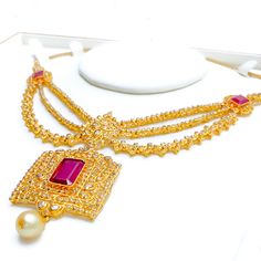 Crafted with exquisite attention to detail, this 22k yellow gold set weighs 54.8 grams and features a royal vintage design. It is adorned with uncut diamonds (Polki), totaling 11.18 carats, and further embellished with rubies and pearls, collectively weighing 34.2 carats. The set has a length of 16 inches, with an impressive drop length of 2.2 inches, and is secured with a hook lock and adjustable links for tailored comfort. The matching earrings, at a length of 2.1 inches, complete the set, eac Elegant 22k Gold Kundan Necklace For Ceremonies, Elegant 22k Gold Kundan Necklace For Ceremonial Occasions, Ceremonial Gold Kundan Necklace, Elegant Heavy 22k Gold Bridal Necklace, Elegant Jeweled Bridal Necklace For Ceremonial Occasion, Gold Kundan Necklace In 22k For Formal Events, 22k Gold Kundan Necklace For Formal Occasions, Formal Bridal Necklace In 22k Gold With Tilla, 22k Gold Bridal Necklace With Tilla For Formal Occasions