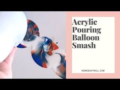 a person is holding an object in their hand with the words acrylic pouring balloon smash on it