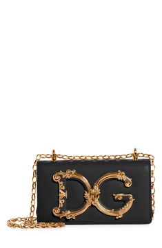 A D&G logo with baroque-inspired gilt flourishes ornately brands this compact leather bag designed with a sliding chain strap that can be worn doubled or long. Style Name:Dolce&gabbana Girls Logo Leather Phone Crossbody Bag. Style Number: 6164781. Classic Gold Shoulder Bag With Logo, Elegant Rectangular Shoulder Bag With Logo Plaque, Luxury Evening Shoulder Bag With Logo Plaque, Classic Gold Bags With Logo Plaque, Elegant Crossbody Bag With Logo Plaque, Designer Gold Shoulder Bag With Logo Plaque, Gold Crossbody Bag With Logo Plaque, Gold Shoulder Bag With Logo Plaque For Evening, Gold Evening Shoulder Bag With Logo Plaque