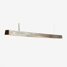 a long rectangular light fixture suspended from a ceiling