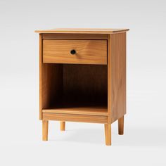 a wooden night stand with one drawer open