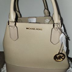 One Purse... Two Looks. This Purse Can Be Converted Into A Traditional Tote Or A Cute Satchel Purse. It Includes A Shoulder Strap That Can Be Used As Well. Michael Kors Beige Satchel With Detachable Handle, Michael Kors Beige Top Handle Shoulder Bag, Michael Kors Beige Shoulder Bag With Detachable Handle, Beige Michael Kors Satchel With Dust Bag, Michael Kors Cream Shoulder Bag With Detachable Handle, Michael Kors Cream Bag With Detachable Handle, Michael Kors Cream Top Handle Shoulder Bag, Michael Kors Beige Bag With Detachable Strap, Michael Kors Beige Shopping Bag