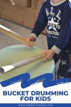 a young boy holding a baseball bat over a plastic bucket with the words bucket drumming for kids