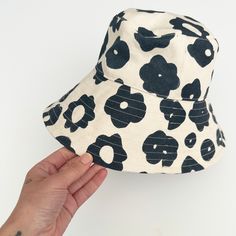 Perfect for a day of fun in the sun, our bucket hat is structured with an extra-wide brim to keep you cool and covered on the go. 100% cotton canvas screen printed with water-based inks Made in California Brim: 3.5" Circumference: 23" To clean: spot clean and/or dry clean. Pre-washed Cotton 5-panel Hat, Trendy Brimmed Cotton Sun Hat, Beach Canvas Wide Brim Bucket Hat, Cotton Beach Bucket Hat With Short Brim, Cotton Bucket Hat With Short Brim For Beach, Trendy Cotton Sun Hat For Vacation, Summer 5-panel Hats One Size Fits Most, Summer 5-panel Hats One Size, Summer 5-panel Hat One Size Fits Most